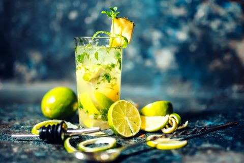 Gin and lime cocktail with pineapple and ice served cold